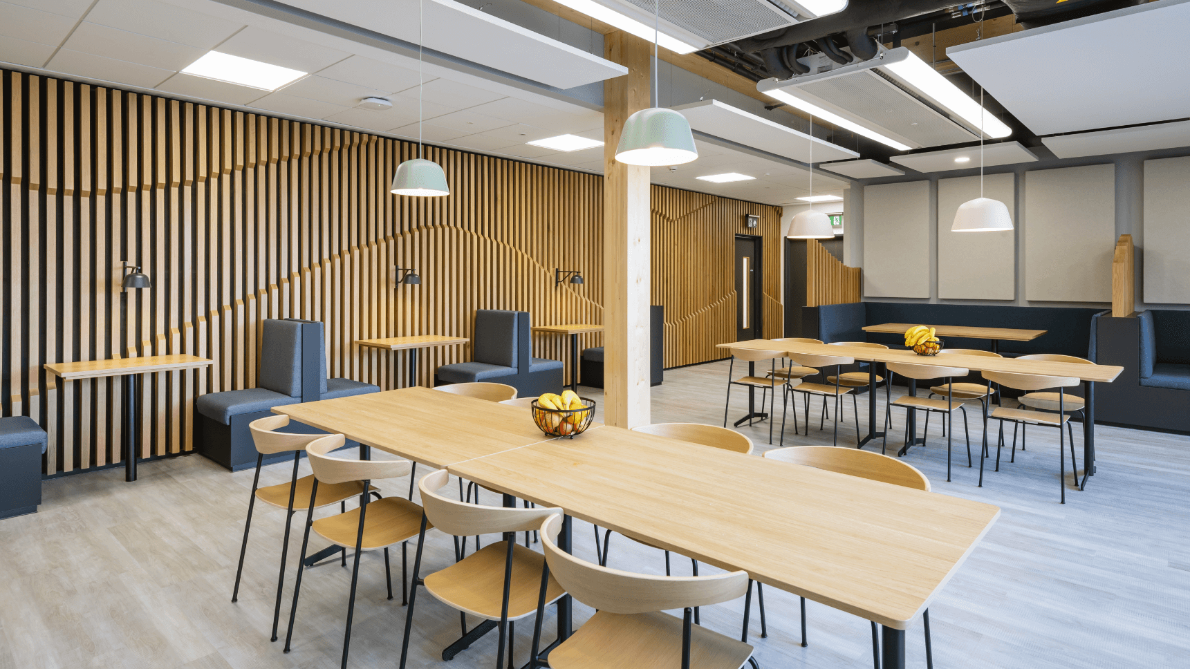 Dogger Bank modern working area with long tables in an open space