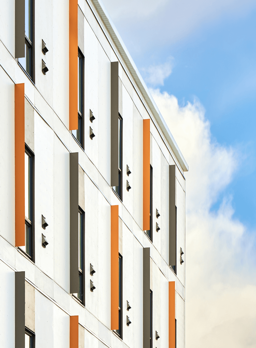 The colourful building exterior against a blue sky